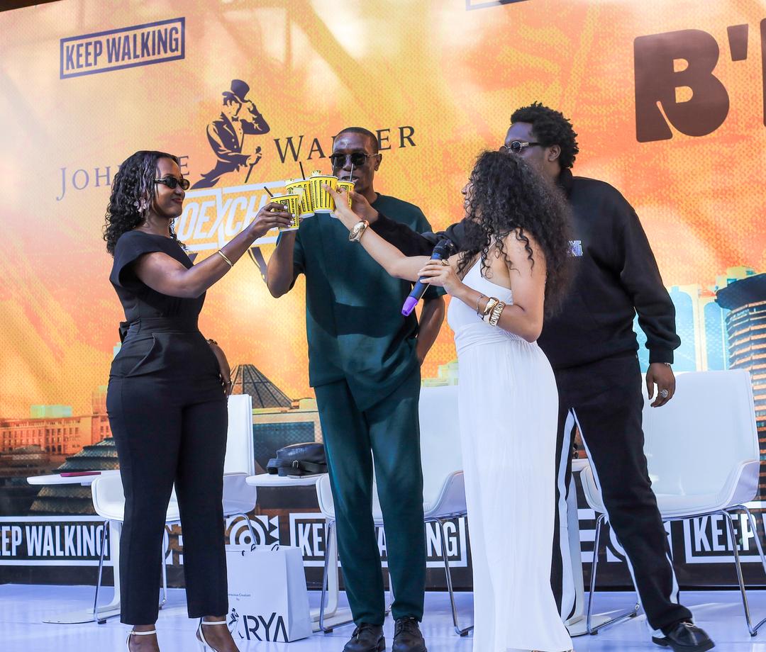 Christine Kyokunda, Brand Manager, Johnnie Walker Uganda on the extreme left posing for a picture with Joshua Baraka.